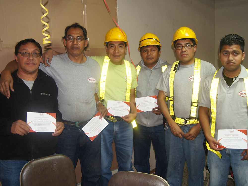 The employees received a diploma to commemorate the achievement.